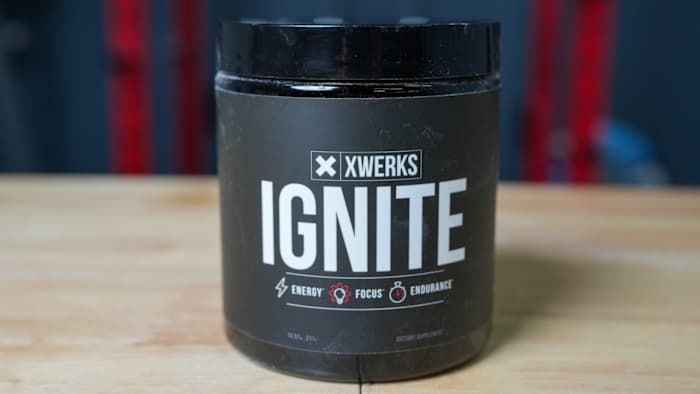 Black tub with white writing that says "XWERKS IGNITE" on a table